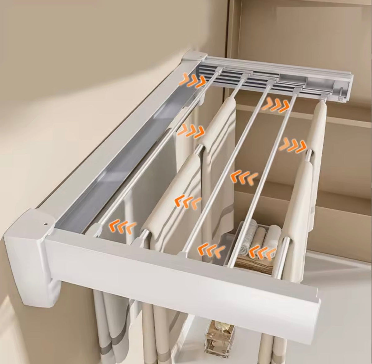Wall-mounted clothes rack with shirts and towels hanging in laundry room